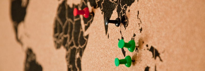 Coloured Pushpins on a map