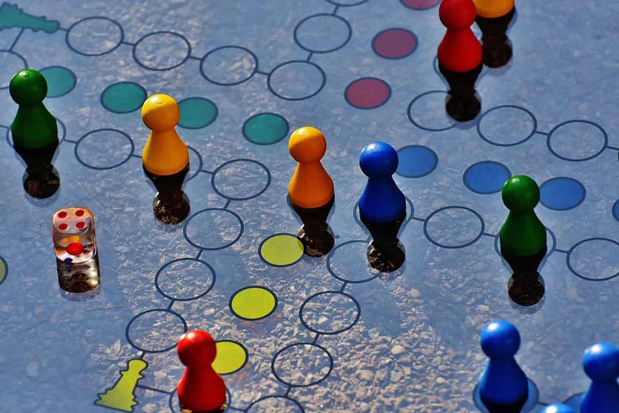 colorful playing pieces on a game board