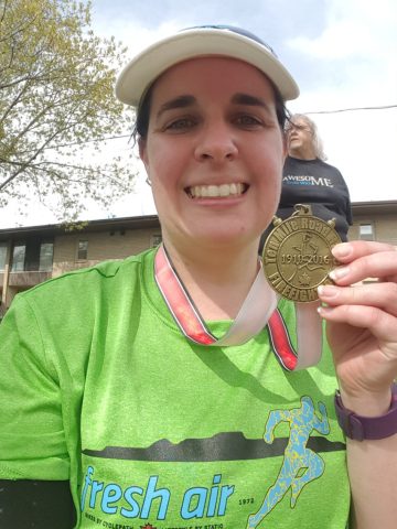 Leanne Mitton with Firefighter's 10 Miler Finishers Medal