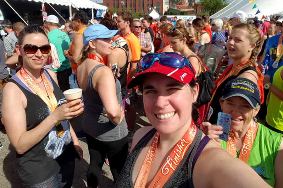 Leanne Mitton smiling with friends before running a half marathon